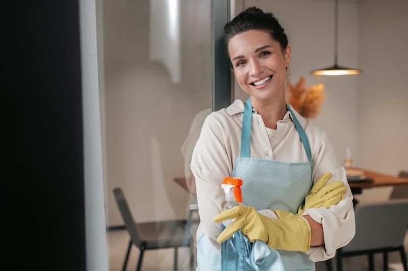 Professional cleaner wiping a benchtop